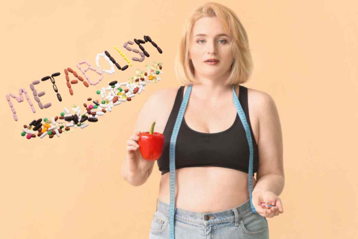 donna con una mela in mano e scritta metabolismo