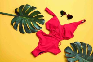 costume intero occhiali e foglie